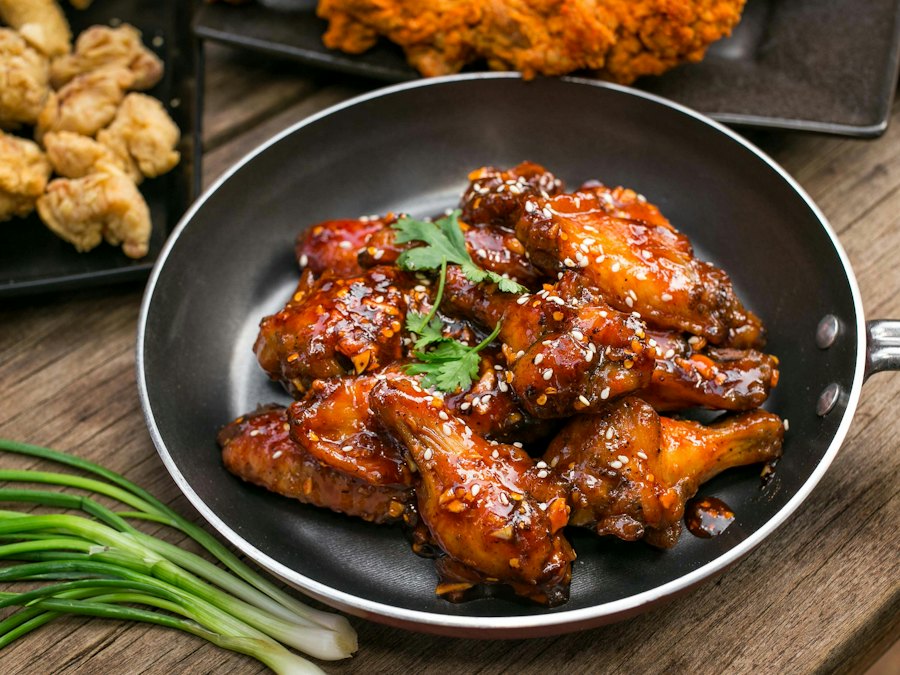 Plate of crispy glazed fried chicken wings