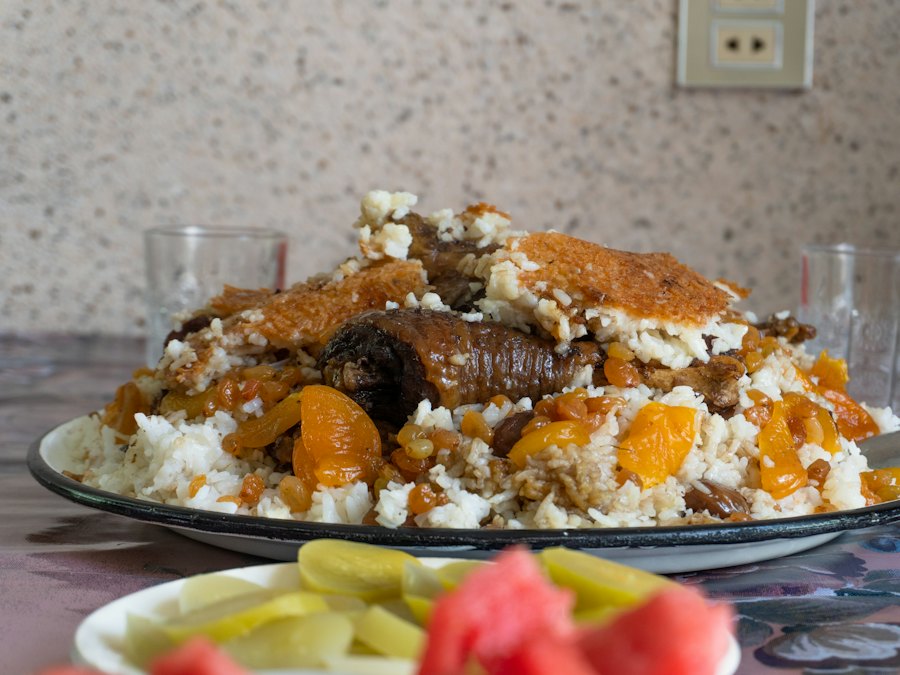 Traditional plov rice pilaf with meat and dried fruit