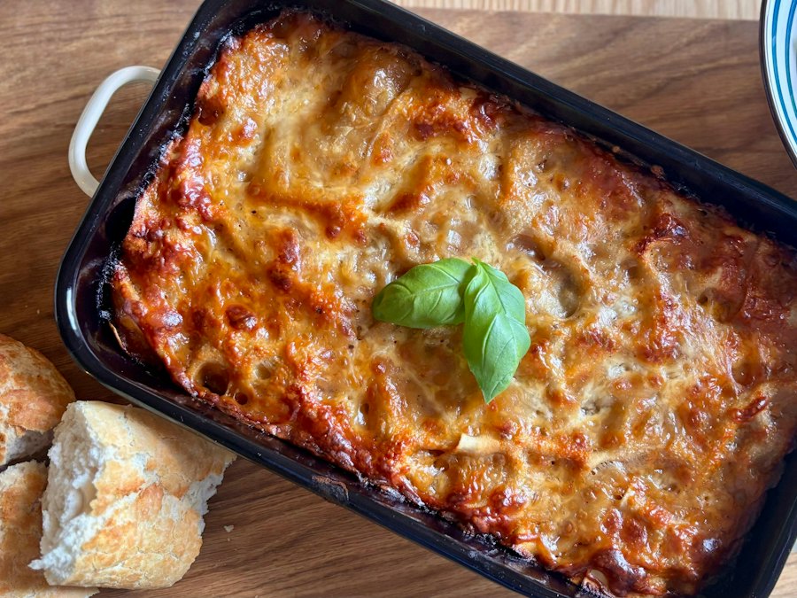 Freshly baked lasagna garnished with basil