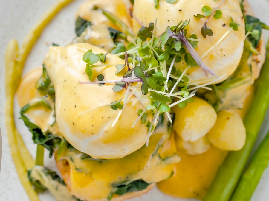 Eggs benedict with asparagus on a plate